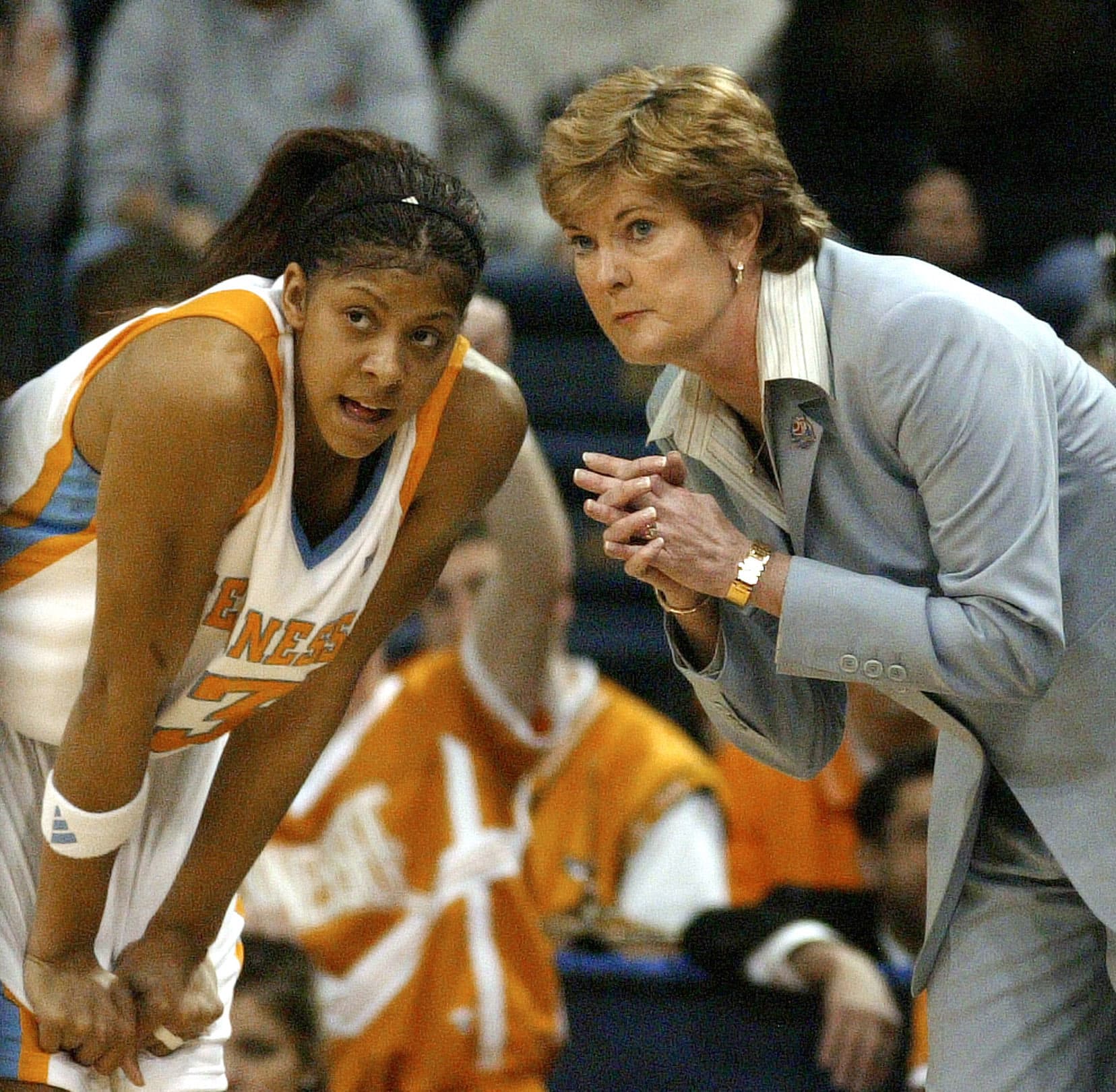 Coach Pat Summitt coaching and guiding a player